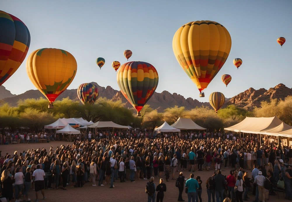 Colorful hot air balloons rise over the Sonoran Desert at sunrise, while crowds gather for the annual Scottsdale Arts Festival in a vibrant city park